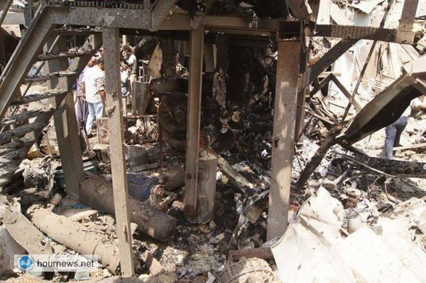 بالصور: هكذا أصبح مصنع يماني في الحديدة بعد قصفه وإحراقه