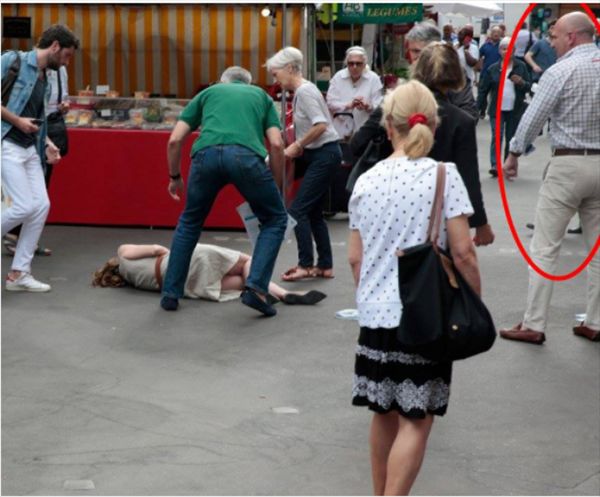 بالصور: رجل يعتدي على وزيرة فرنسية ويطرحها أرضاً في أحد أسواق باريس